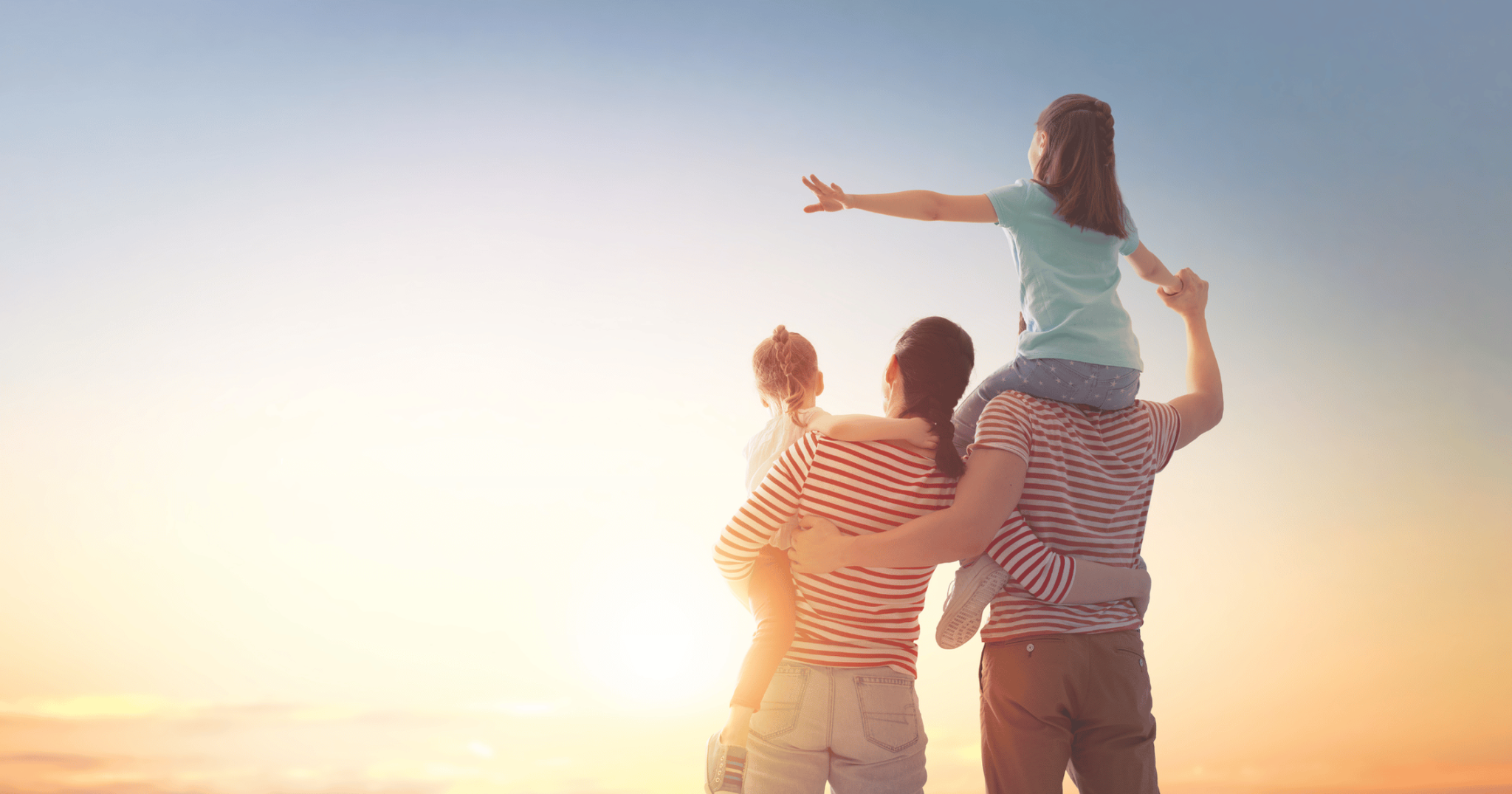 Happy family walking together at sunset, symbolising legacy planning and the role of testamentary trusts in securing future generations.