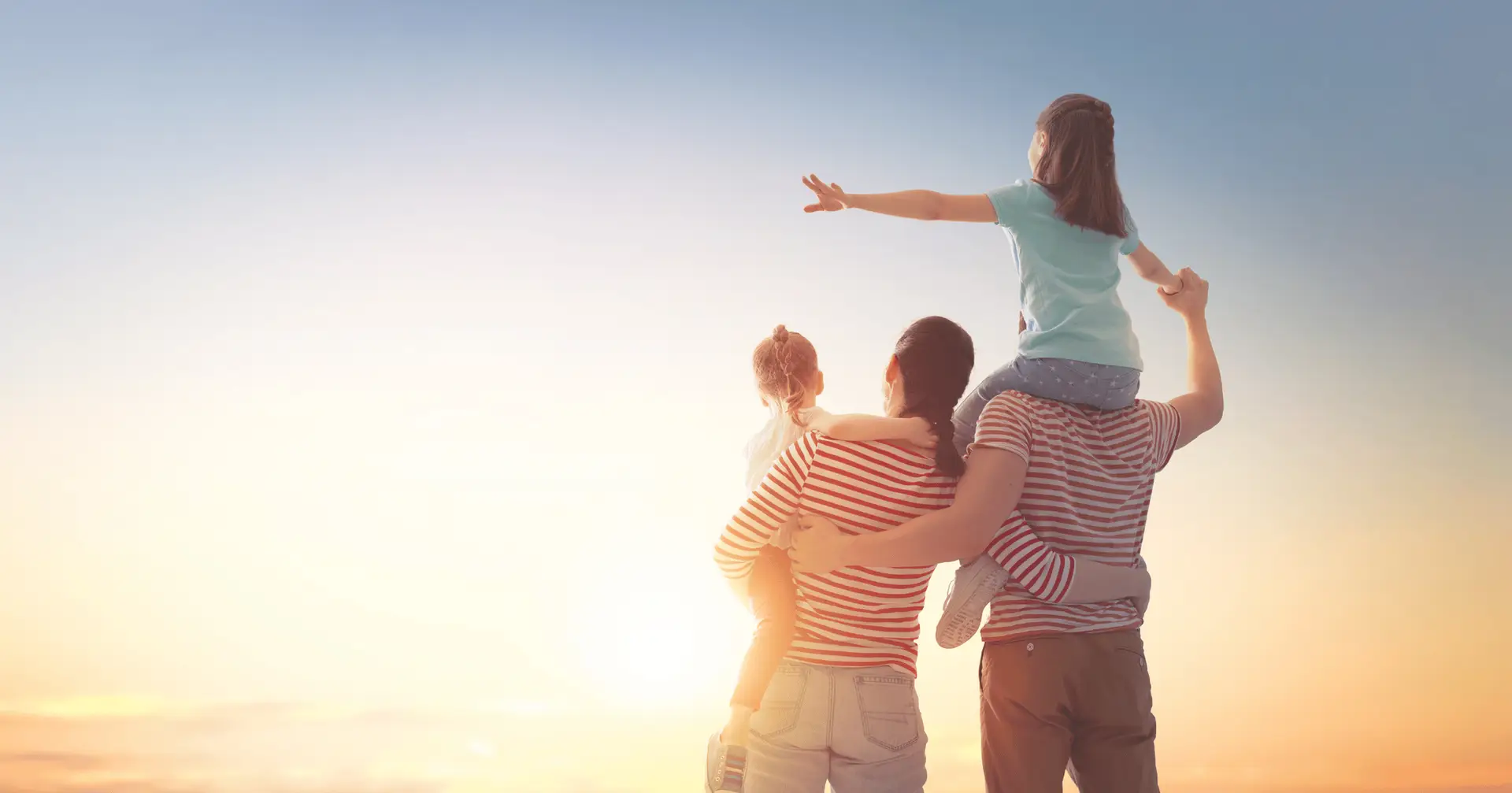 Happy family walking together at sunset, symbolising legacy planning and the role of testamentary trusts in securing future generations.