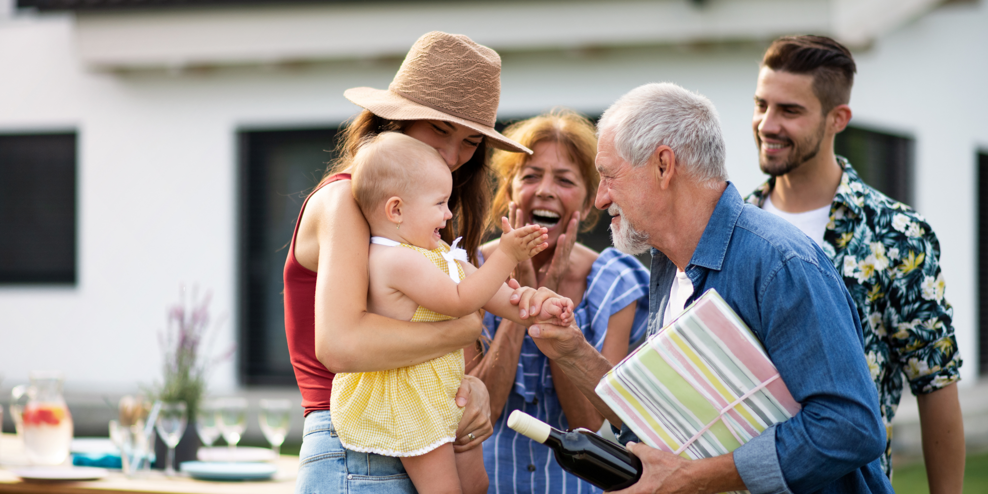 Family celebrating together, highlighting the importance of protecting family assets through a testamentary trust.