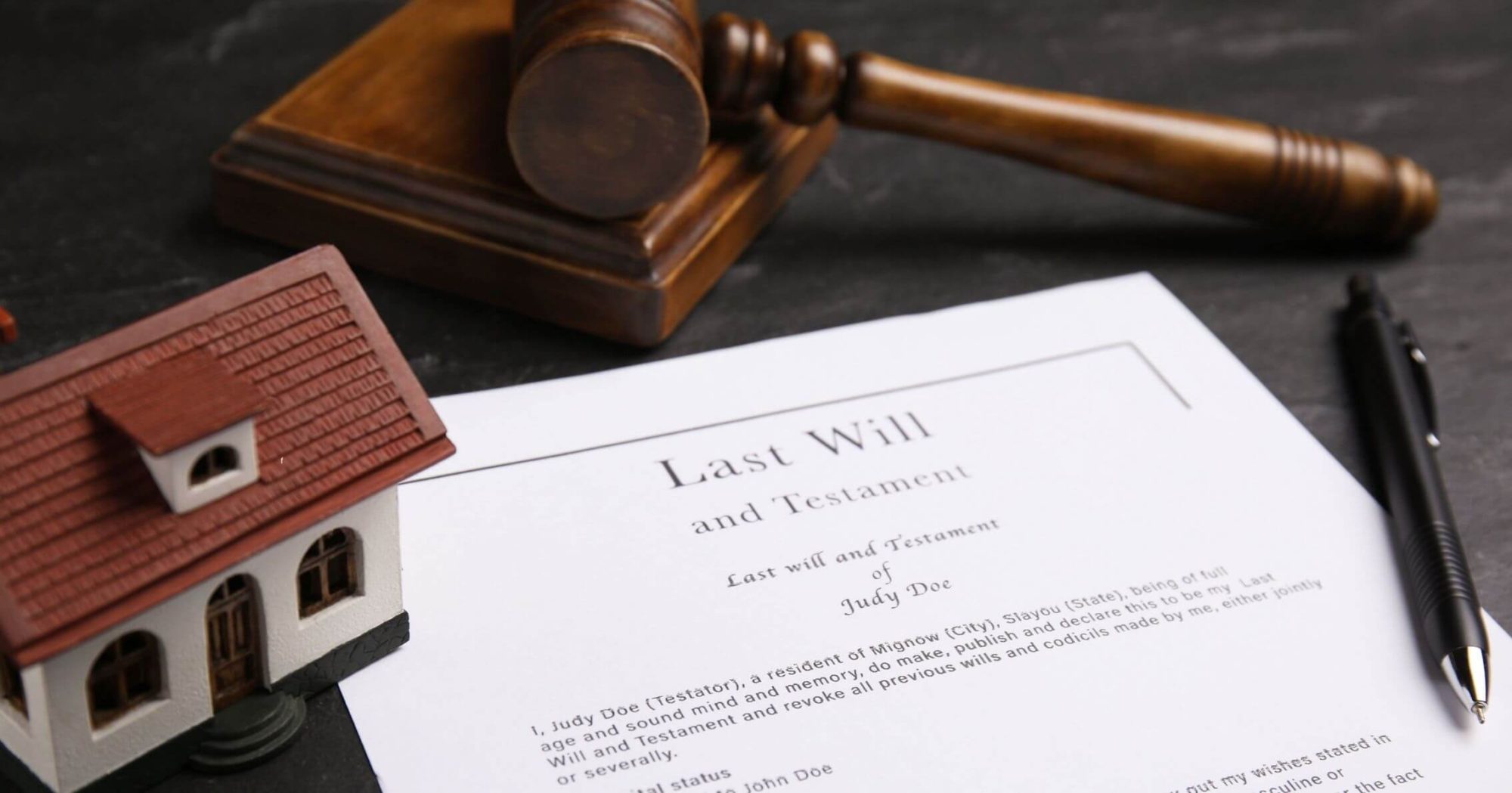 Legal will document with a gavel, model house, and pen – Eleven Legal probate services