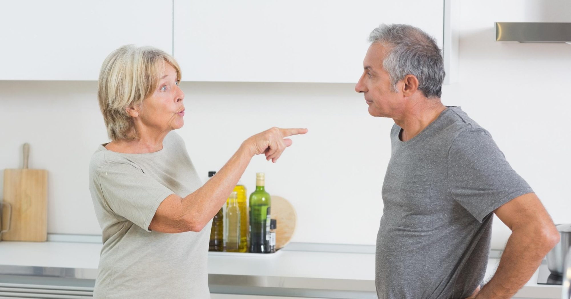 Older couple arguing in a kitchen – Eleven Legal estate and will dispute resolution