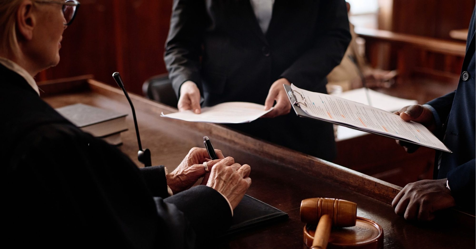 Lawyer presenting documents to a judge in court – Eleven Legal litigation services