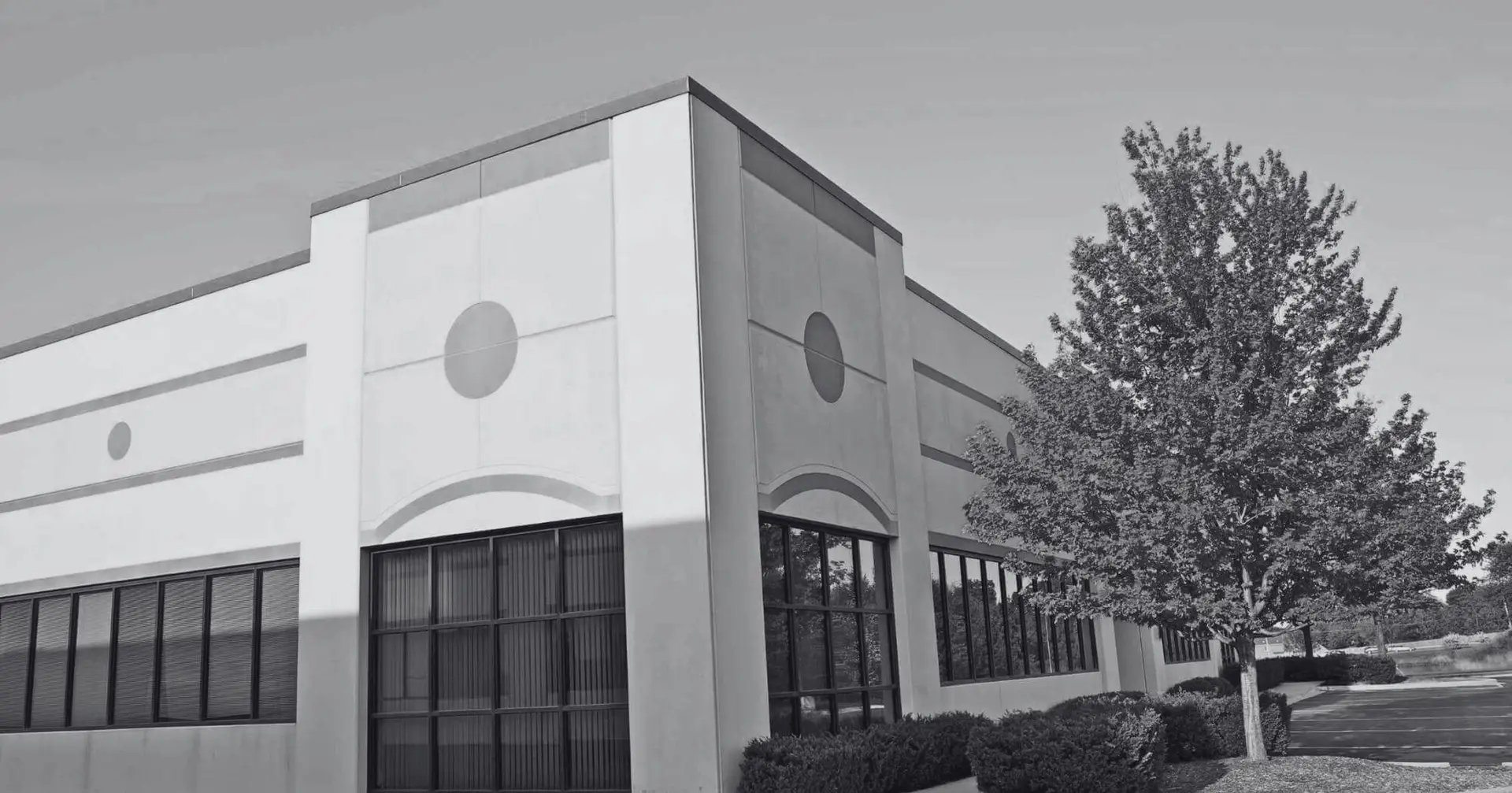 Modern commercial or retail building with clear skies – Eleven Legal