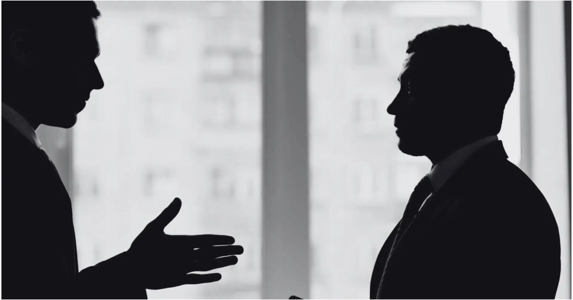 Two business professionals in a discussion – Eleven Legal corporate legal advice