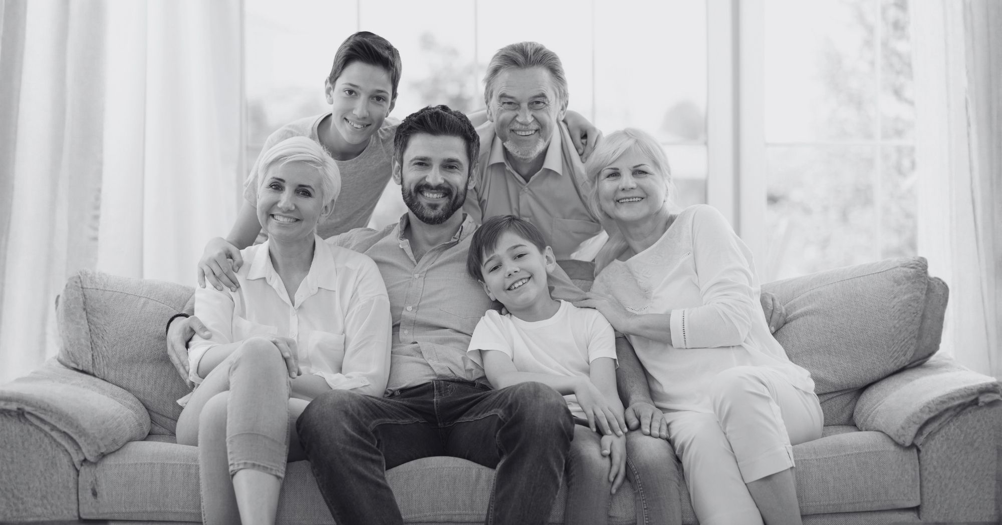 Multigenerational family in family room – Eleven Legal