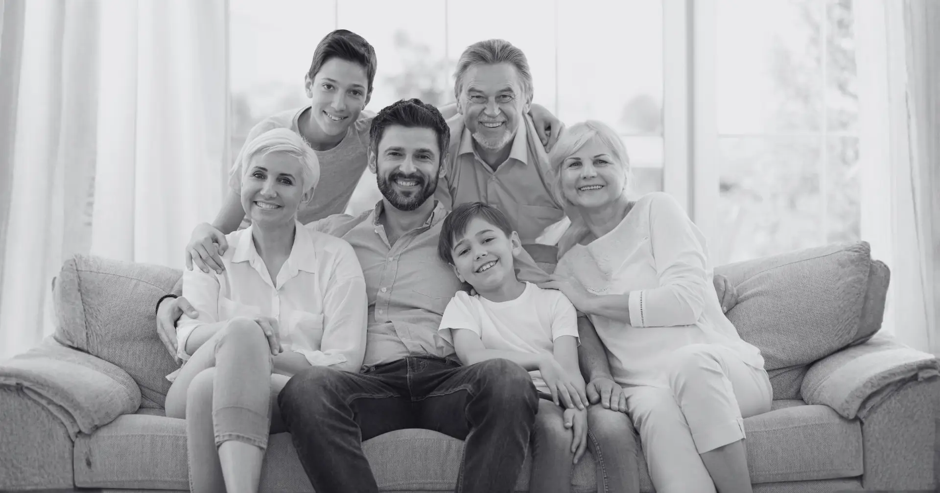 Multigenerational family in family room – Eleven Legal